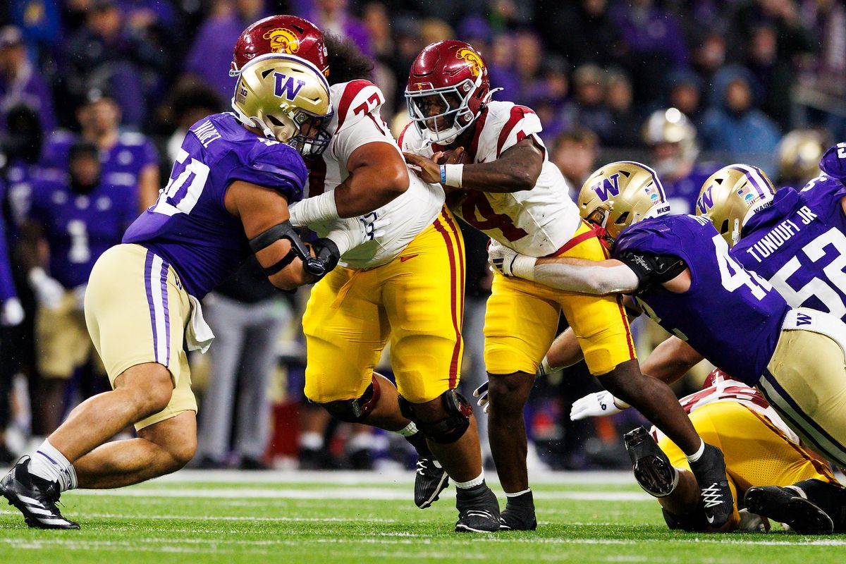 USC Trojans running back Woody Marks #4 runs with the ball during the first half against Washington Huskies at Husky Stadium on November 2, 2024 in Seattle, Washington. 