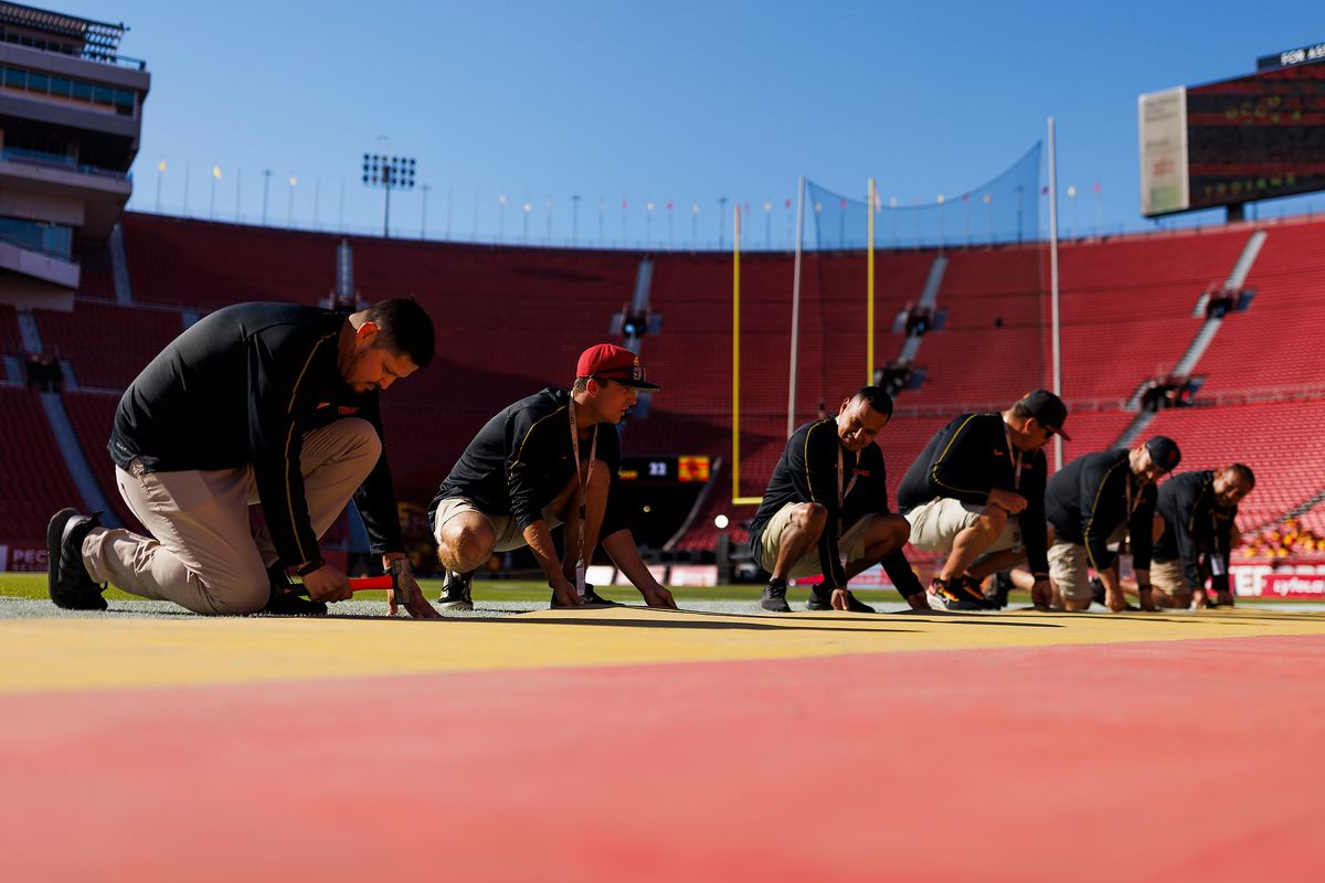 USC grounds crew sets up the field before a game against Nebraska Cornhuskers, November 16 2024 at The Los Angeles Memorial Coliseum in Los Angeles. 