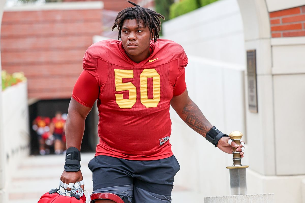 USC Offensive Lineman J'Onre Reed (50) grabs the Trojan sword during fall practice, Friday August 1, 2025 in Los Angeles. USC Offensive Lineman J'Onre Reed (50) grabs the Trojan sword during fall practice, Friday August 1, 2025 in Los Angeles.