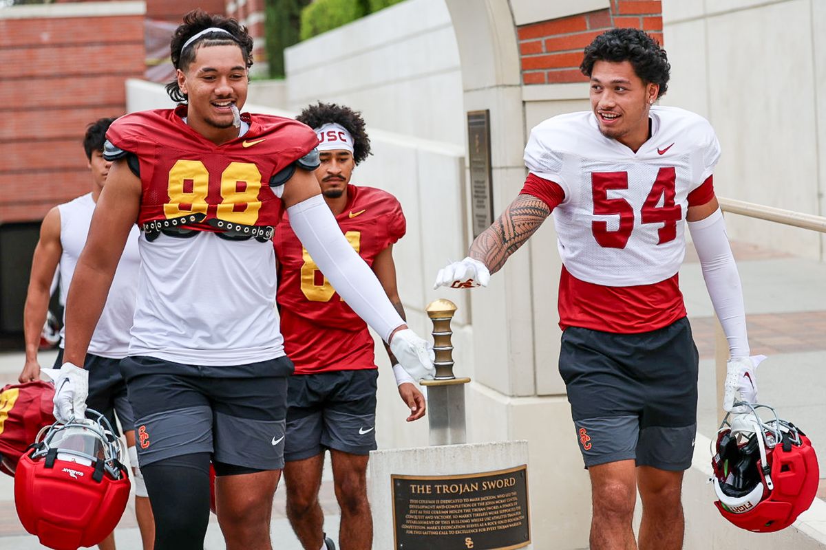 USC Tight End Taniela Tupou (88) touches the Trojan sword during fall practice, Friday August 1, 2025 in Los Angeles. USC Tight End Taniela Tupou (88) touches the Trojan sword during fall practice, Friday August 1, 2025 in Los Angeles.