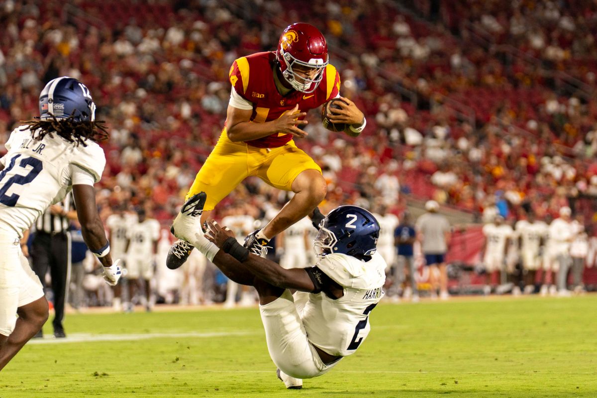 Southern California Trojans quarterback Jayden Maiava (14) hurdles the defender during an NCAA football game against the Georgia Southern Eagles, Saturday September 6th, 2025 in Los Angeles, California. 