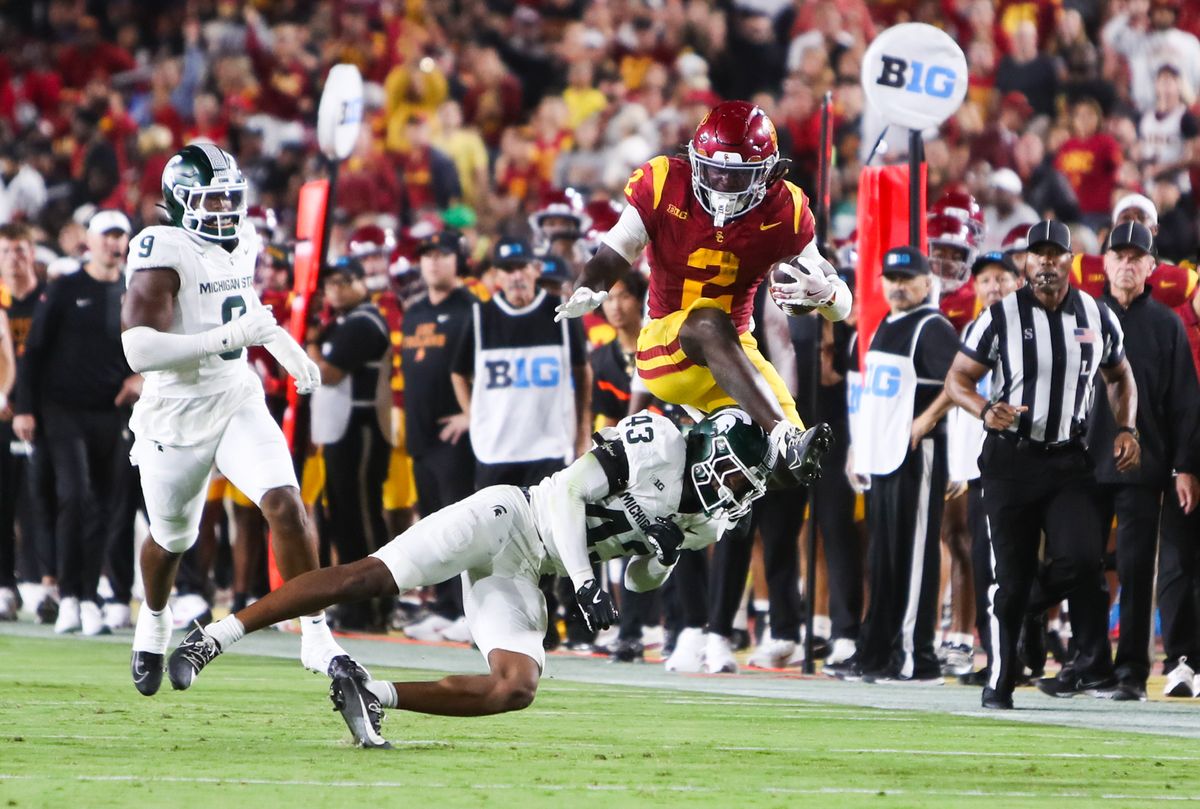 #2 Waymond Jordan of USC leaps over a defender during an NCAA football game against Michigan State, September 20, 2025 in Los Angeles, CA.