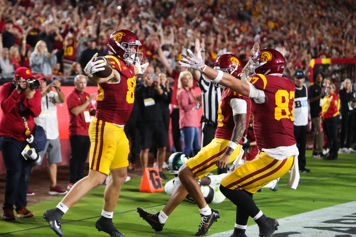 #85 Walker Lyons of USC celebrates a touchdown catch with teammates during an NCAA football game against Michigan State, September 20, 2025 in Los Angeles, CA.