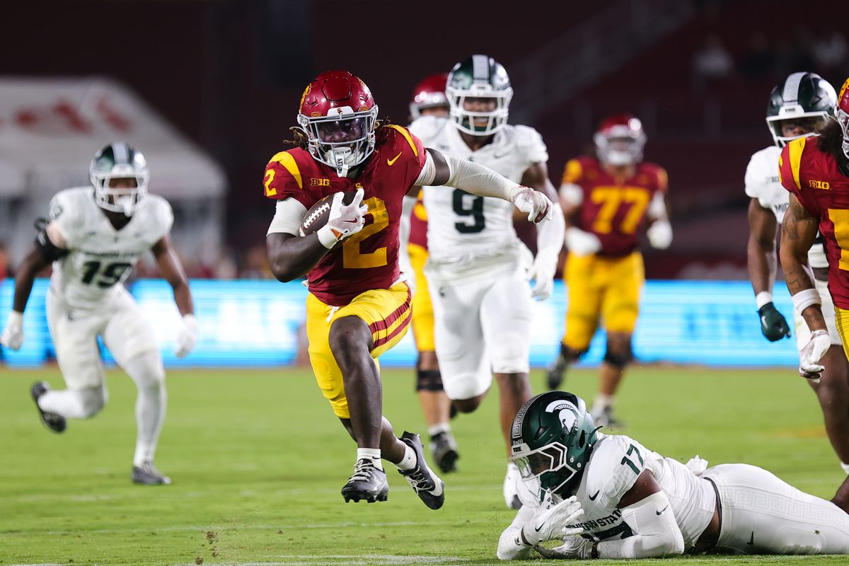 #2 Waymond Jordan of USC carries the football upfield during an NCAA football game against Michigan State, September 20, 2025 in Los Angeles, CA.
