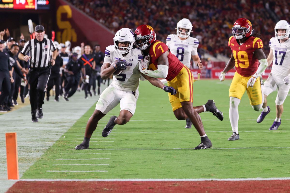Running back Caleb Komolafe #5 of the Northwestern Wildcats rushes towards the goal line during an NCAA football game against the USC Trojans, Friday November 7, 2025 in Los Angeles, Calif. Running back Caleb Komolafe #5 of the Northwestern Wildcats rushes towards the goal line during an NCAA football game against the USC Trojans, Friday November 7, 2025 in Los Angeles, Calif.