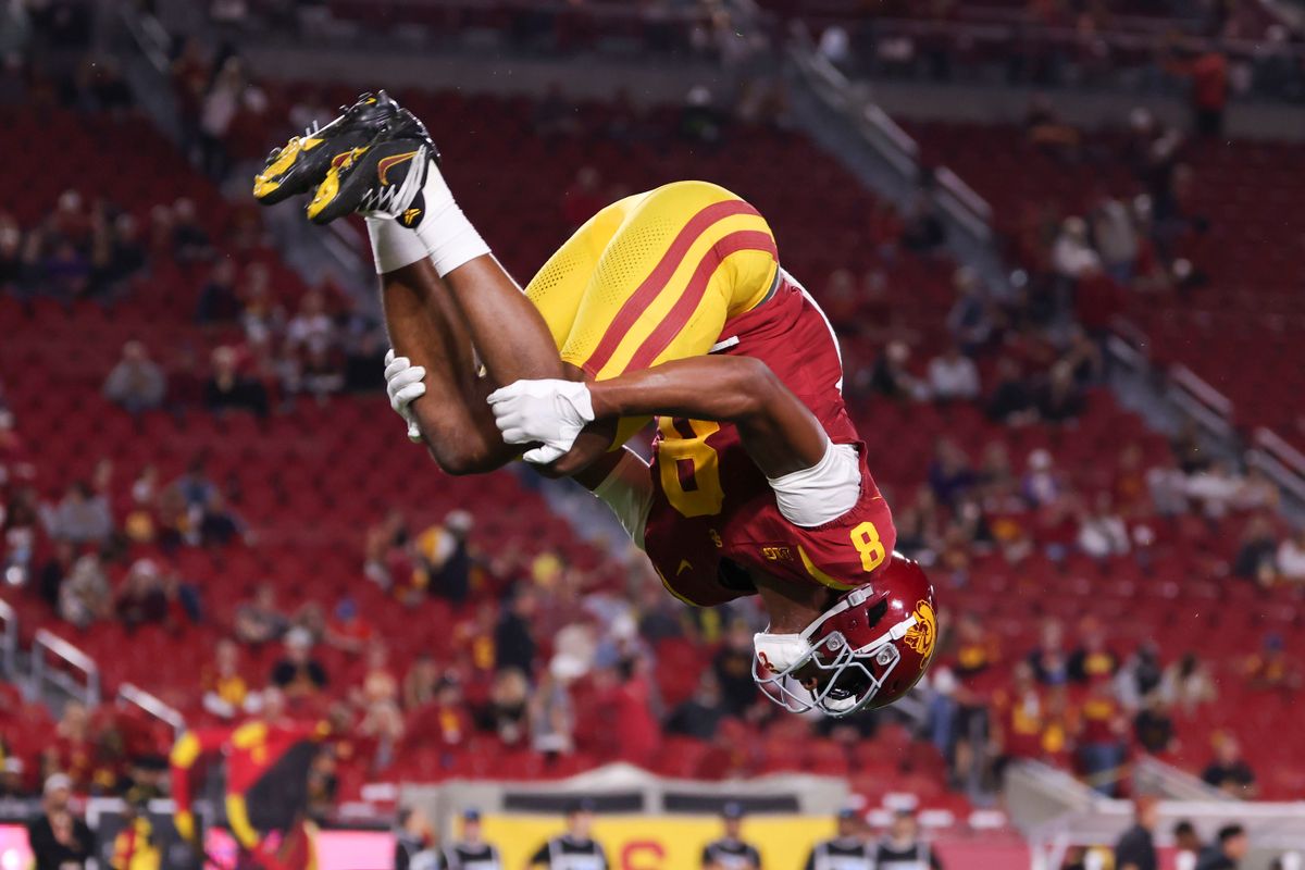 Wide receiver Ja'Kobi Lane #8 of the USC Trojans does a flip on the field before an NCAA football game against the Northwestern Wildcats, Friday November 7, 2025 in Los Angeles, Calif. Wide receiver Ja'Kobi Lane #8 of the USC Trojans does a flip on the field before an NCAA football game against the Northwestern Wildcats, Friday November 7, 2025 in Los Angeles, Calif.