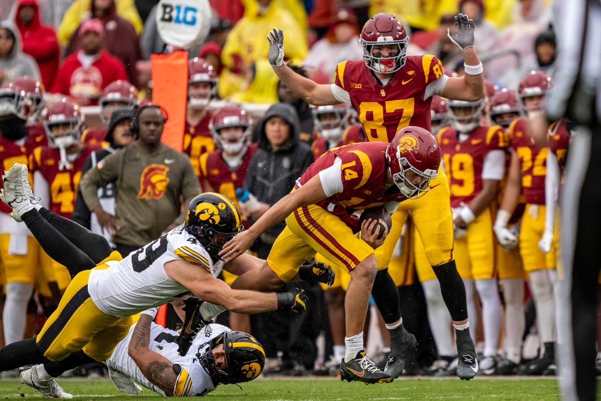 USC Trojans quarterback, Jayden Maiava (14) breaks a tackle during an NCAAF football game against the Iowa Hawkeyes on November 15, 2025 in Los Angeles, CA. USC Trojans quarterback, Jayden Maiava (14) breaks a tackle during an NCAAF football game against the Iowa Hawkeyes on November 15, 2025 in Los Angeles, CA.