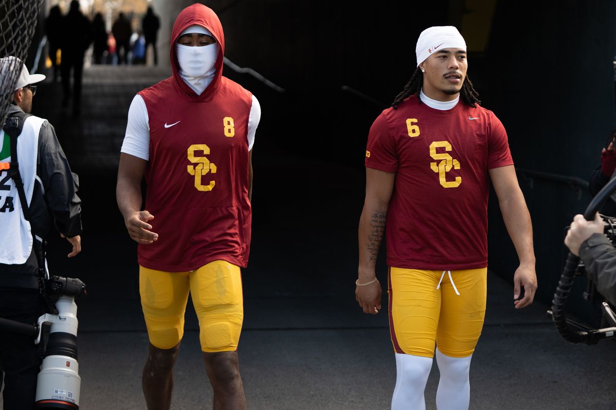 USC Trojans wide receivers, Makai Lemon (6) and Ja' Kobi Lane (8) walk out for warm ups during an NCAAF football game against the Oregon Ducks on November 22, 2025 in Eugene, OR.