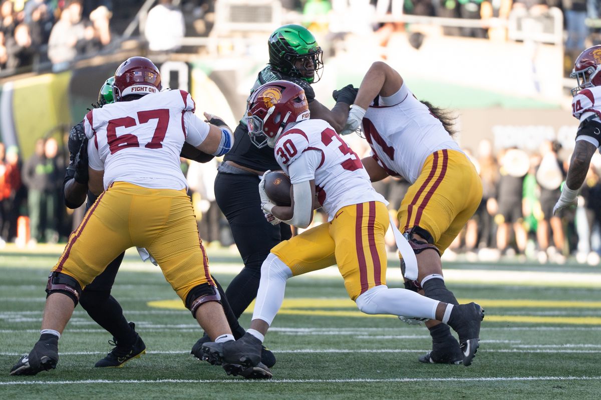 USC Trojans wide running back, King Miller (30) finds a gap and runs through it during an NCAAF football game against the Oregon Ducks on November 22, 2025 in Eugene, OR.