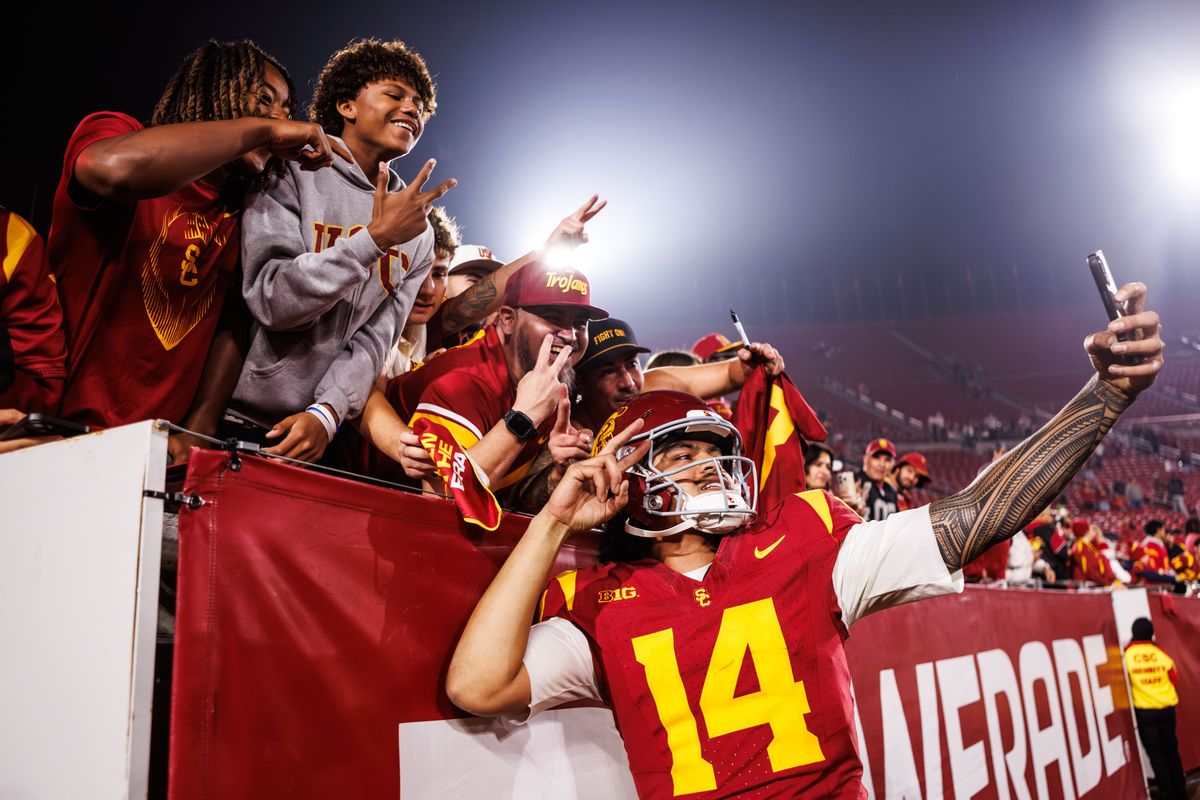 Southern California Trojans quarterback Jayden Maiava (14) celebrates with fans after a NCAAF game against the UCLA Bruins on November 29, 2025 in Los Angeles, CA.