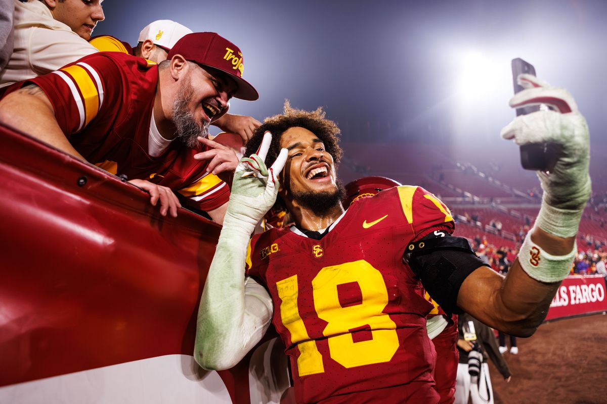Southern California Trojans linebacker Eric Gentry (18) celebrates with fans after a NCAAF game against the UCLA Bruins on November 29, 2025 in Los Angeles, CA.