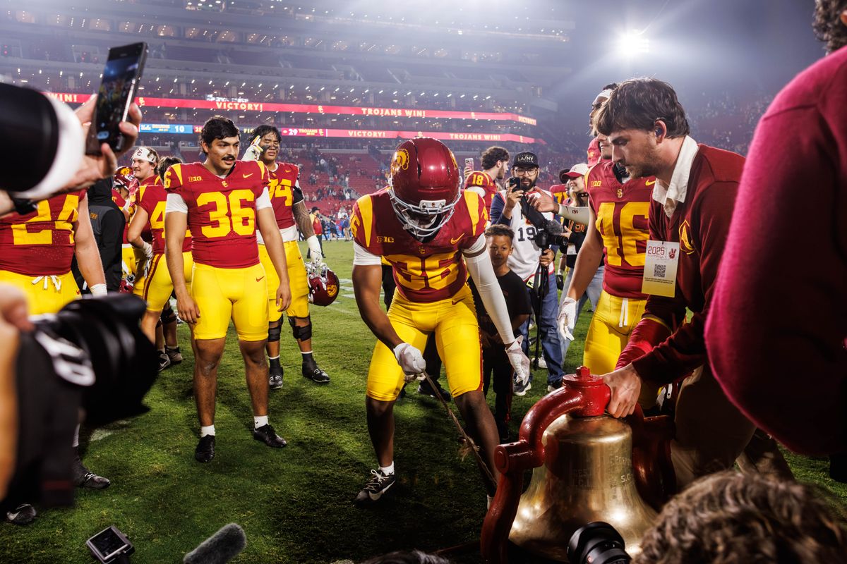 Southern California Trojans safety Steve Miller (36) rings the victory bell after a NCAAF game against the UCLA Bruins on November 29, 2025 in Los Angeles, CA.