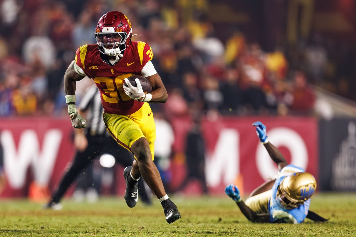 Southern California Trojans safety Steve Miller (36) runs the ball and avoids UCLA Bruins defense during an NCAAF game against the UCLA Bruins on November 29, 2025 in Los Angeles, CA.
