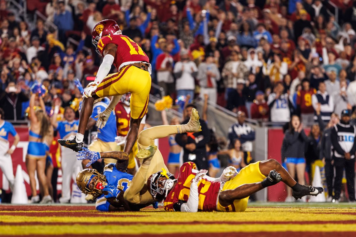 UCLA Bruins wide receiver Kwazi Gilmer (3) lands into the end zone for a touchdown during a NCAAF game against the Southern California Trojans on November 29, 2025 in Los Angeles, CA.