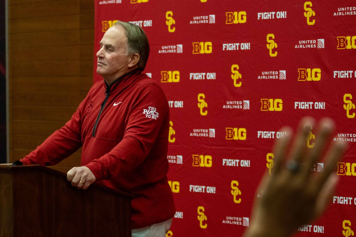 A reporter raises their hand to ask a question to new USC football defensive coordinator Gary Patterson during a press conference at the John McKay Center Wednesday, January 28, 2026 in Los Angeles, Calif.