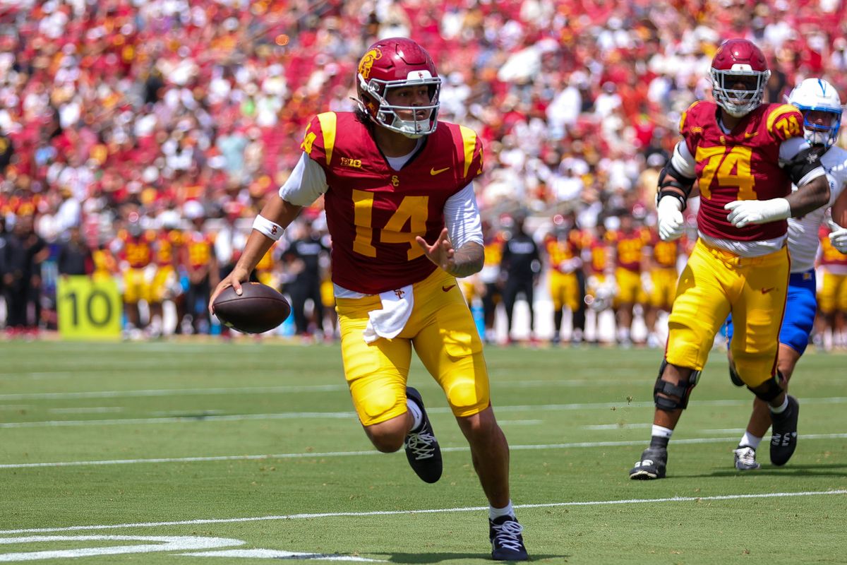 USC Trojan QB Jayden Maiava (14) runs with the football during an NCAA football game agains the San Jose State Spartans on August 29, 2026 in Los Angeles, CA. USC Trojan QB Jayden Maiava (14) runs with the football during an NCAA football game agains the San Jose State Spartans on August 29, 2026 in Los Angeles, CA.