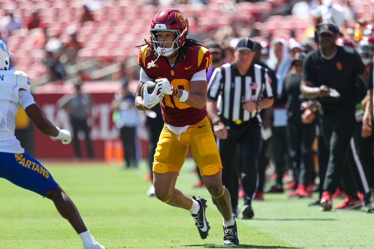 USC Trojan WR Corey Simms (10) runs with the football during an NCAA football game agains the San Jose State Spartans on August 29, 2026 in Los Angeles, CA. USC Trojan WR Corey Simms (10) runs with the football during an NCAA football game agains the San Jose State Spartans on August 29, 2026 in Los Angeles, CA.