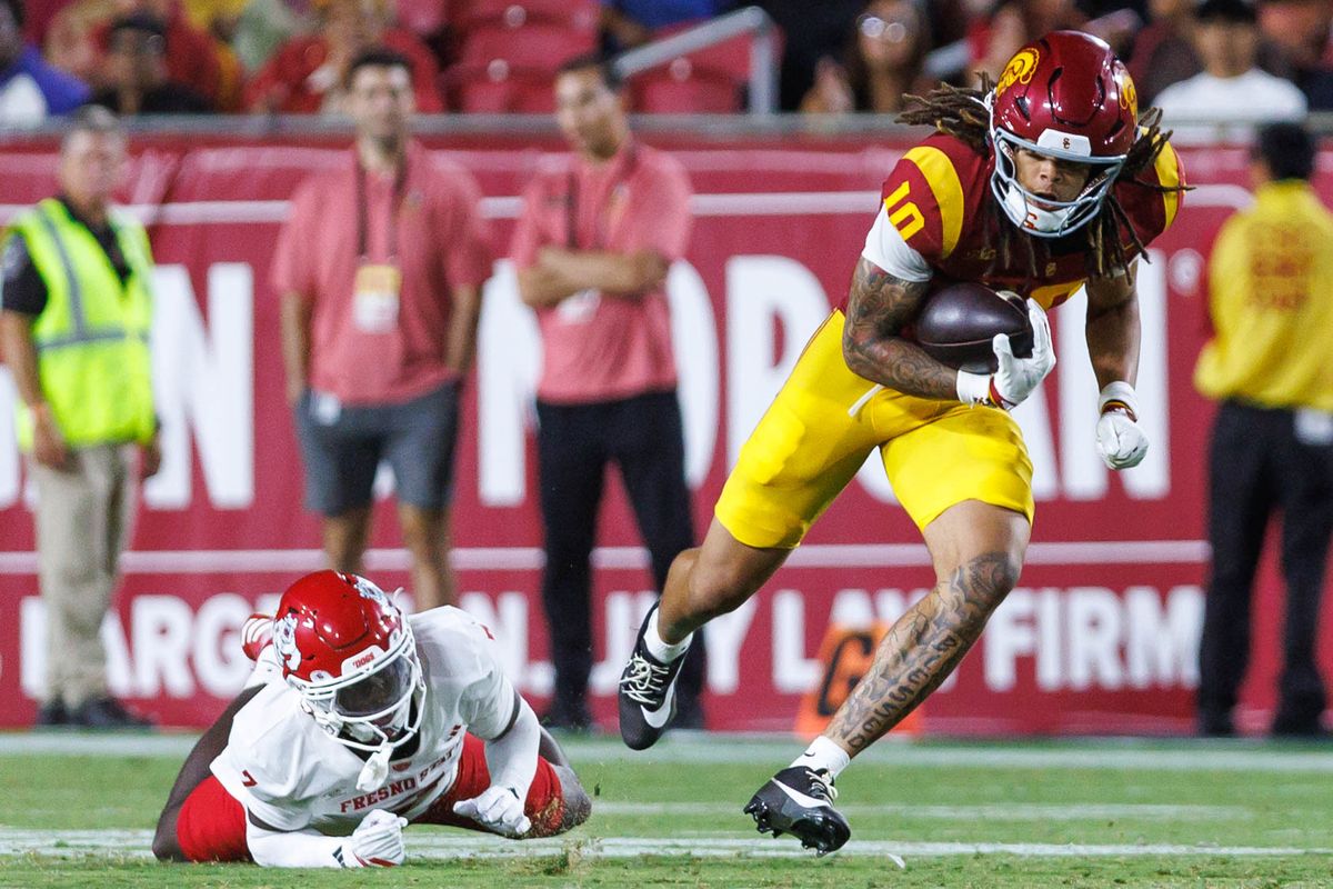 Corey Simms #10 of the USC Trojans evades a tackle during an NCAA Football game against the Fresno State Bulldogs on September 4, 2026 at The Los Angeles Memorial Coliseum in Los Angeles, California. Corey Simms #10 of the USC Trojans evades a tackle during an NCAA Football game against the Fresno State Bulldogs on September 4, 2026 at The Los Angeles Memorial Coliseum in Los Angeles, California.