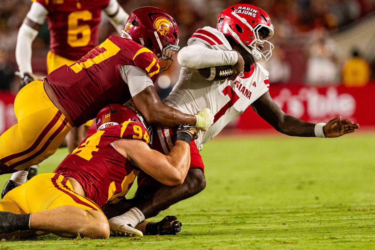USC defense swarms the offense during an NCAA Football game against the Louisiana Ragin Cajuns on September 12th, 2026 at The Los Angeles Memorial Coliseum in Los Angeles, California. USC defense swarms the offense during an NCAA Football game against the Louisiana Ragin Cajuns on September 12th, 2026 at The Los Angeles Memorial Coliseum in Los Angeles, California.