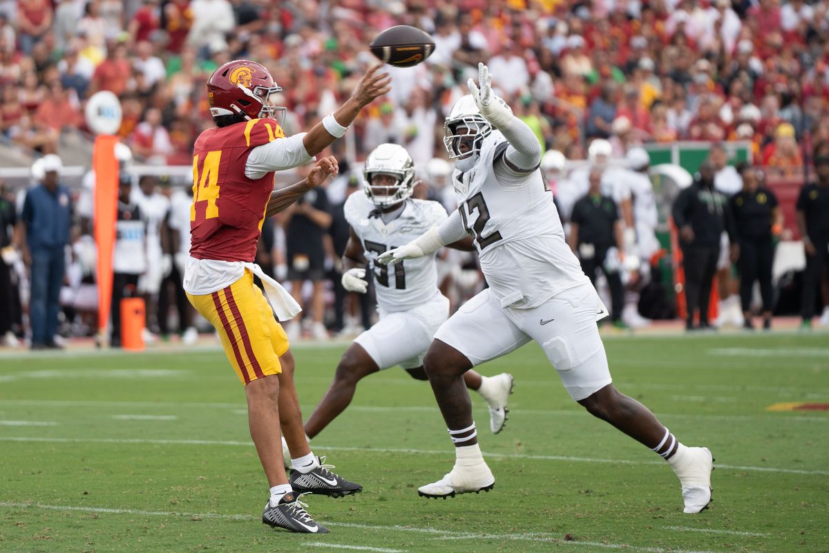USC Trojan QB Jayden Maiava (14) gets rid of the ball before getting sacked during an NCAA football game against the Oregon Ducks on September 26, 2026 in Los Angeles, CA. USC Trojan QB Jayden Maiava (14) gets rid of the ball before getting sacked during an NCAA football game against the Oregon Ducks on September 26, 2026 in Los Angeles, CA.