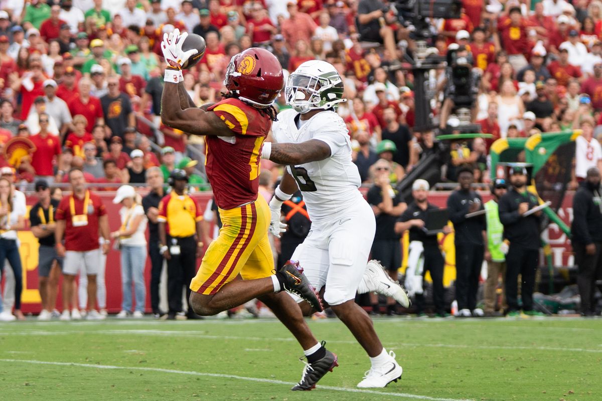 USC Trojan WR makes a catch while his defender was on his back during an NCAA football game against the Oregon Ducks on September 26, 2026 in Los Angeles, CA. USC Trojan WR makes a catch while his defender was on his back during an NCAA football game against the Oregon Ducks on September 26, 2026 in Los Angeles, CA.