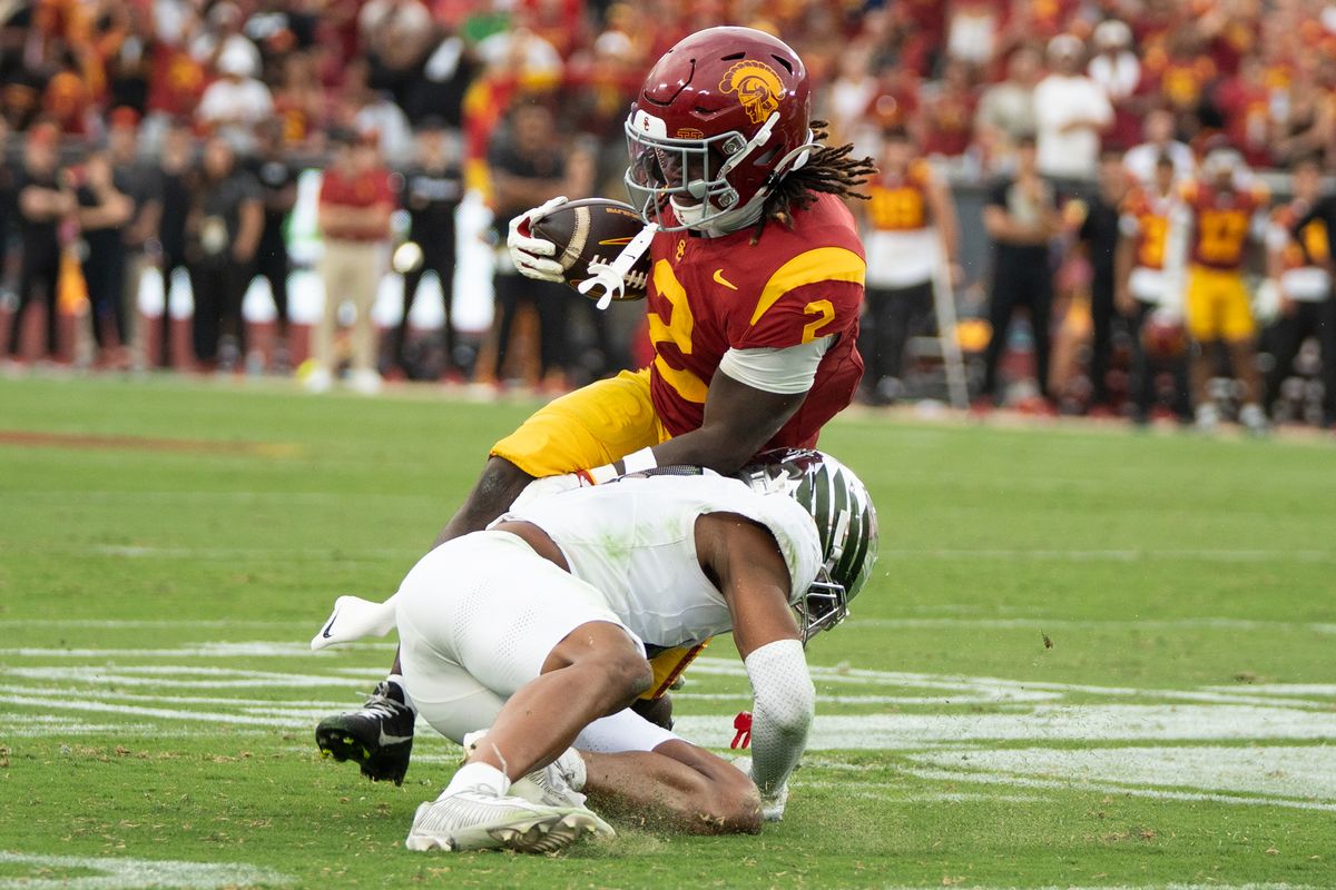 USC Trojan RB Waymond Jordan (2) trucks his defender to get extra yards during an NCAA football game against the Oregon Ducks on September 26, 2026 in Los Angeles, CA. USC Trojan RB Waymond Jordan (2) trucks his defender to get extra yards during an NCAA football game against the Oregon Ducks on September 26, 2026 in Los Angeles, CA.
