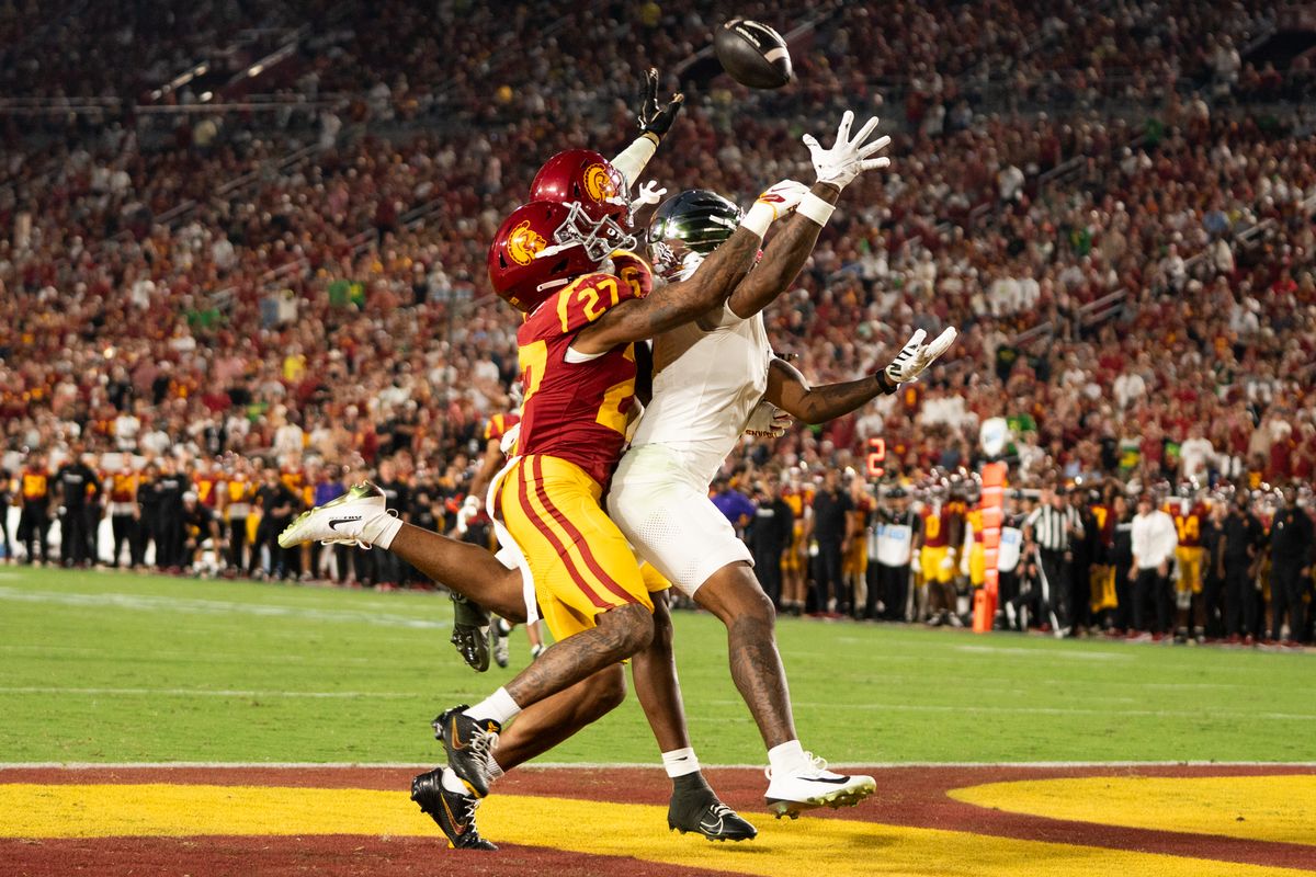 USC Trojan defense smothers the offensive player and knocks the ball down during an NCAA football game against the Oregon Ducks on September 26, 2026 in Los Angeles, CA. USC Trojan defense smothers the offensive player and knocks the ball down during an NCAA football game against the Oregon Ducks on September 26, 2026 in Los Angeles, CA.