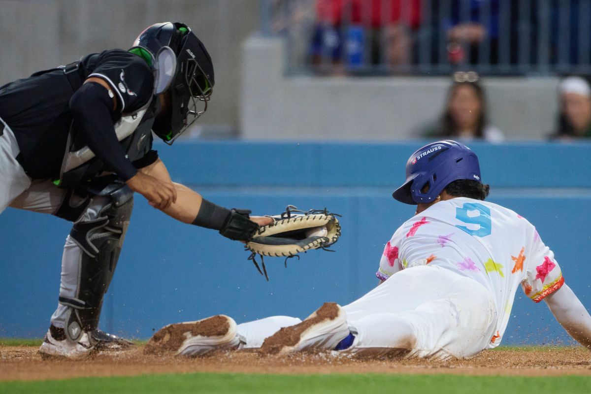 The Ontario Tower Buzzers Joendry Vargas #9 slides into home during an MiLB game against The Lake Elsinore Storm, April 29th, 2026 in Ontario  California.