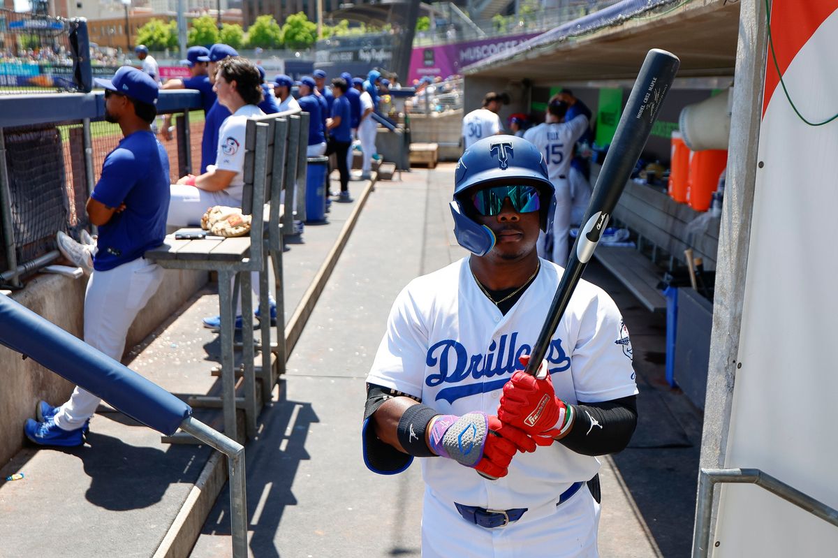 Zyhir Hope #13 of the Tulsa Drillers walks through the dugout with his bat during a game against the Arkansas Travelers at ONEOK Field on April 19, 2026 in Tulsa, Oklahoma.