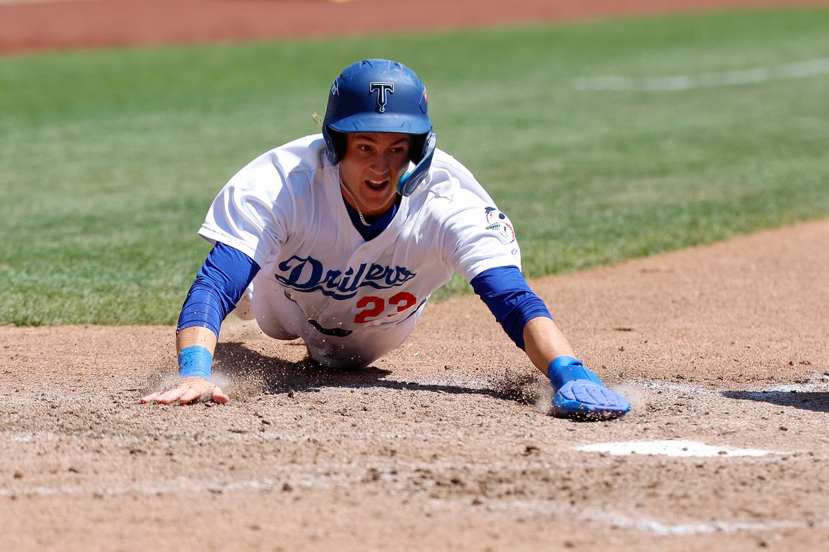 Kyle Nevin #23 of the Tulsa Drillers scores a run during a game against the Arkansas Travelers at ONEOK Field on April 19, 2026 in Tulsa, Oklahoma.
