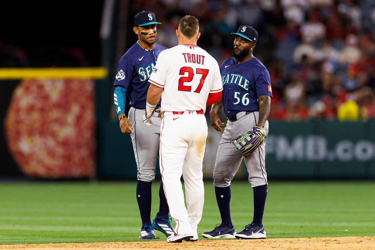 Mike Trout #27 of the Los Angeles Angels talks to Julio Rodriguez #44 of the Seattle Mariners and Randy Arozarena #56 of the Seattle Mariners during the game at Angel Stadium of Anaheim on April 3, 2026 in Anaheim, California. Mike Trout #27 of the Los Angeles Angels talks to Julio Rodriguez #44 of the Seattle Mariners and Randy Arozarena #56 of the Seattle Mariners during the game at Angel Stadium of Anaheim on April 3, 2026 in Anaheim, California.