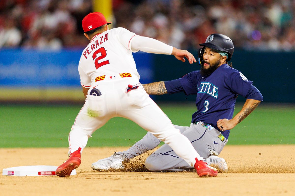 Oswald Peraza #2 of the Los Angeles Angels tags J.P. Crawford #3 of the Seattle Mariners at second base during the game at Angel Stadium of Anaheim on April 3, 2026 in Anaheim, California. Oswald Peraza #2 of the Los Angeles Angels tags J.P. Crawford #3 of the Seattle Mariners at second base during the game at Angel Stadium of Anaheim on April 3, 2026 in Anaheim, California.