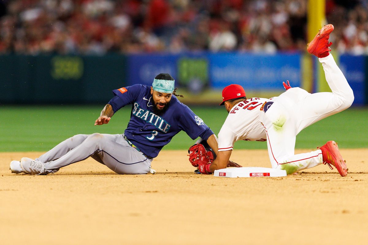 Oswald Peraza #2 of the Los Angeles Angels tags J.P. Crawford #3 of the Seattle Mariners at second base during the game at Angel Stadium of Anaheim on April 3, 2026 in Anaheim, California. Oswald Peraza #2 of the Los Angeles Angels tags J.P. Crawford #3 of the Seattle Mariners at second base during the game at Angel Stadium of Anaheim on April 3, 2026 in Anaheim, California.