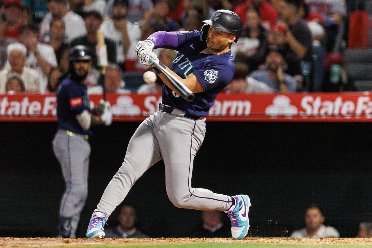 Dominic Canzone #8 of the Seattle Mariners makes contact with the ball during an MLB match against the Los Angeles Angels at Angel Stadium on April 4, 2026 in Anaheim, California. Dominic Canzone #8 of the Seattle Mariners makes contact with the ball during an MLB match against the Los Angeles Angels at Angel Stadium on April 4, 2026 in Anaheim, California.