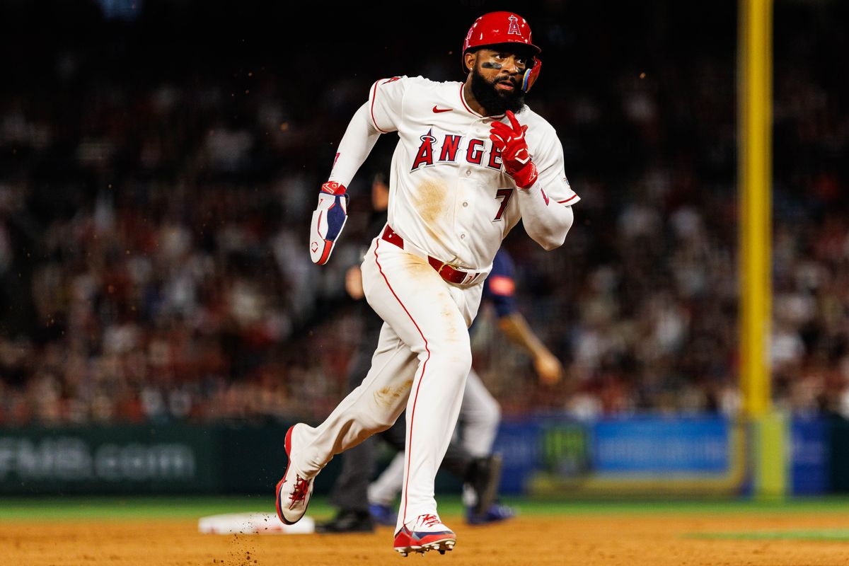 Jo Adell #7 of the Los Angeles Angels runs to third base during an MLB match against the Seattle Mariners at Angel Stadium on April 4, 2026 in Anaheim, California. Jo Adell #7 of the Los Angeles Angels runs to third base during an MLB match against the Seattle Mariners at Angel Stadium on April 4, 2026 in Anaheim, California.