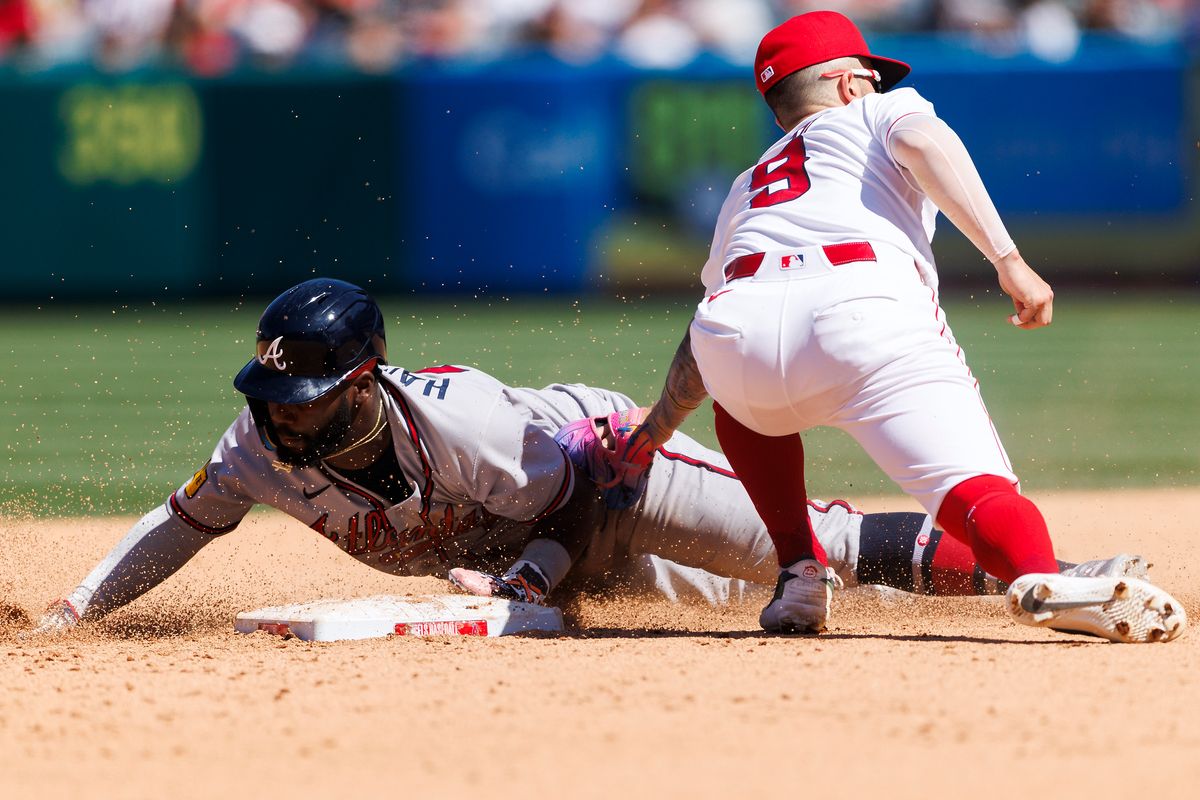Zach Neto #9 of the Los Angeles Angels tags Michael Harris II #23 of the Atlanta Braves during the game at Angel Stadium of Anaheim on April 8, 2026 in Anaheim, California. Zach Neto #9 of the Los Angeles Angels tags Michael Harris II #23 of the Atlanta Braves during the game at Angel Stadium of Anaheim on April 8, 2026 in Anaheim, California.