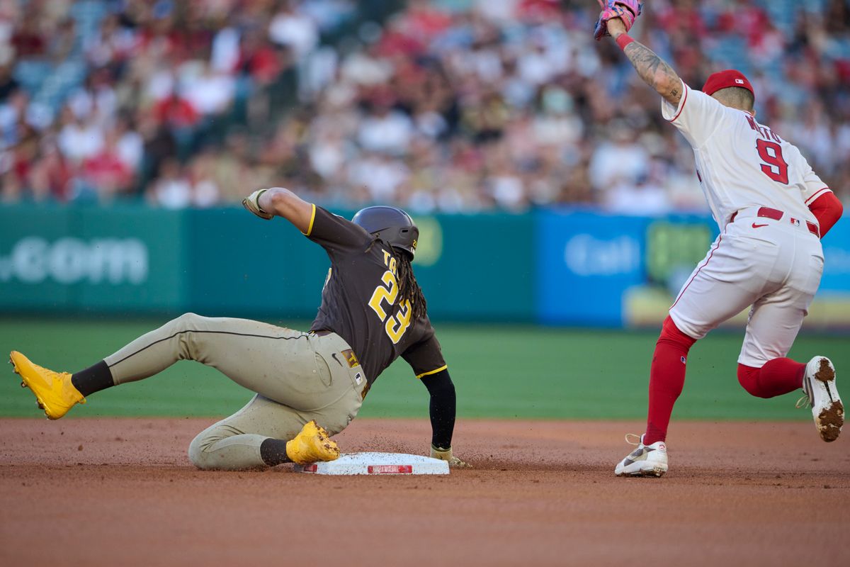 The Los Angeles Angels Zach Neto #9 gets San Diego Padres Fernando Tatis Jr. #23 out at second during an MLB game against the San Diego Padres, April 18th, 2026 in Anaheim California.
