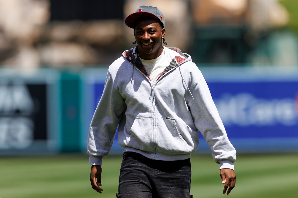 King Miller of the USC Trojans celebrates after throwing out the first pitch before the game between the San Diego Padres and the Los Angeles Angels at Angel Stadium of Anaheim on April 19, 2026 in Anaheim, California.