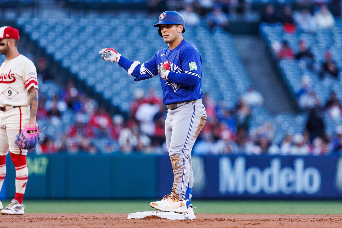 Daulton Varsho #5 of the Toronto Blue Jays celebrates after getting on base during an MLB game against the Los Angeles Angels at Angel Stadium on April 21, 2026 in Anaheim, California.