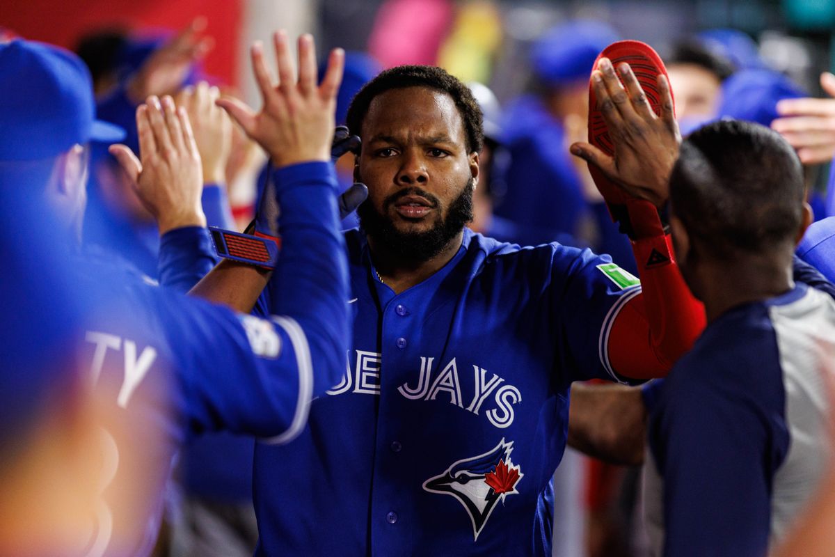 Vladimir Guerrero Jr. #27 of the Toronto Blue Jays celebrates after scoring a run an MLB game against the Los Angeles Angels at Angel Stadium on April 21, 2026 in Anaheim, California.