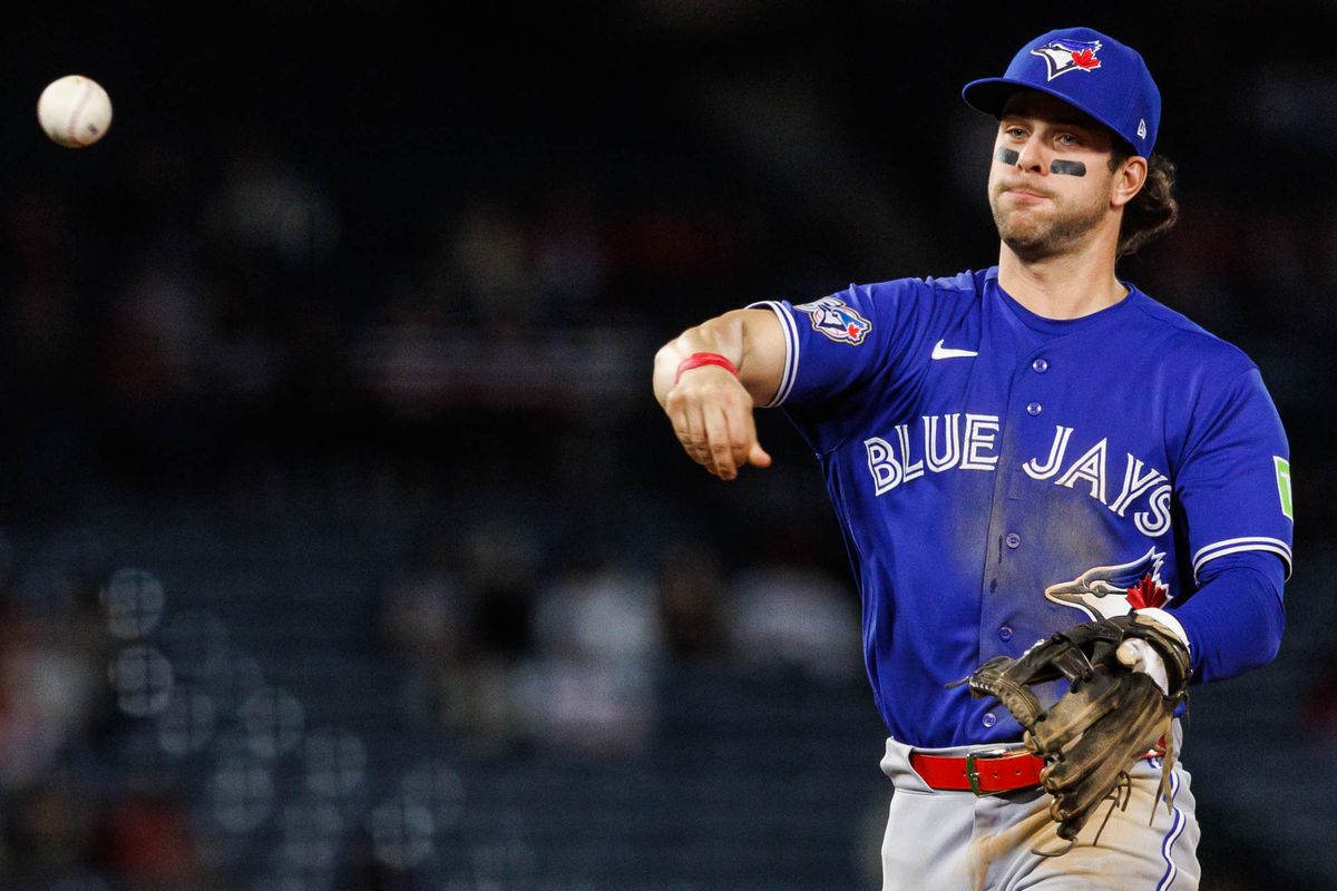 Ernie Clement #22 of the Toronto Blue Jays throws the ball during an MLB game against the Los Angeles Angels at Angel Stadium on April 21, 2026 in Anaheim, California.