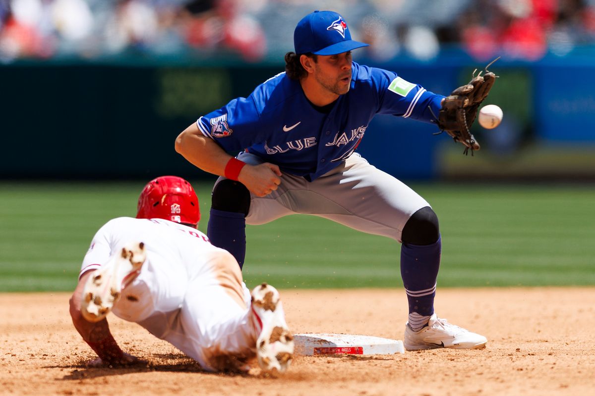 Logan O’Hoppe #14 of the Los Angeles Angels dives back to second base during the game against the Toronto Blue Jays at Angel Stadium of Anaheim on April 22, 2026 in Anaheim, California.