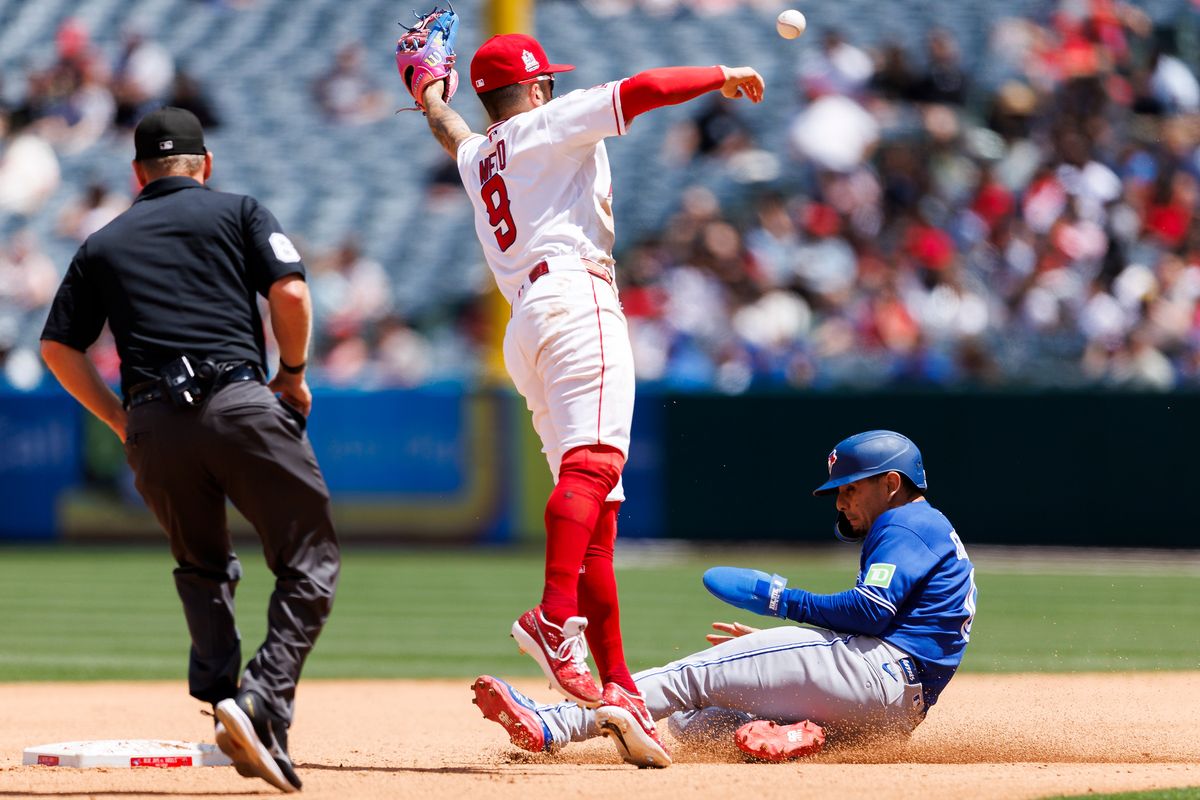 Zach Neto #9 of the Los Angeles Angels leaps to catch the ball during the game against the Toronto Blue Jays at Angel Stadium of Anaheim on April 22, 2026 in Anaheim, California. 