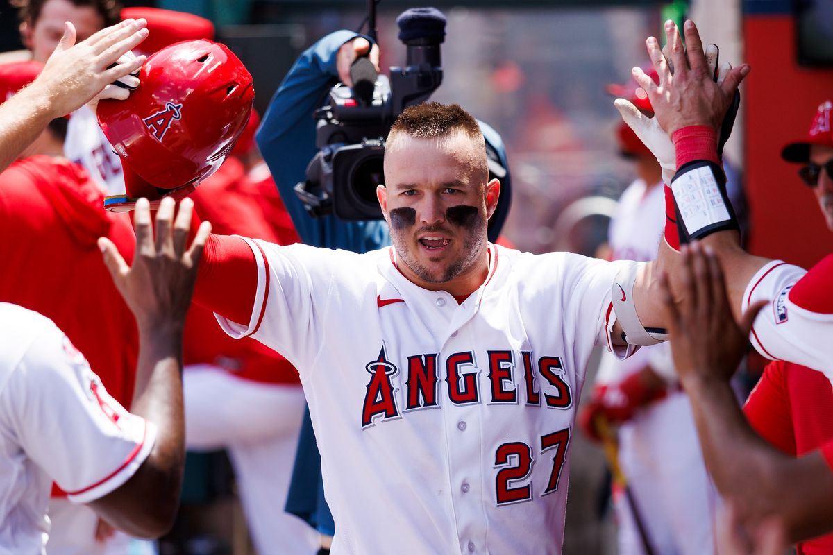 Mike Trout #27 of the Los Angeles Angels celebrate his home run in the dugout during the game against the Toronto Blue Jays at Angel Stadium of Anaheim on April 22, 2026 in Anaheim, California. 