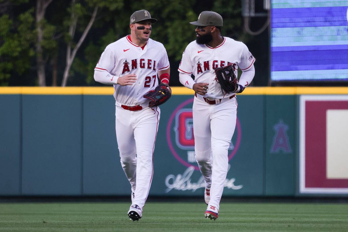 Los Angeles Angels outfielder Mike Trout (27) and outfielder Jo Adell (7) run during the MLB game against the Los Angeles Dodgers Friday May 15th, 2026 at Angel's Stadium in Anaheim, Calif.
