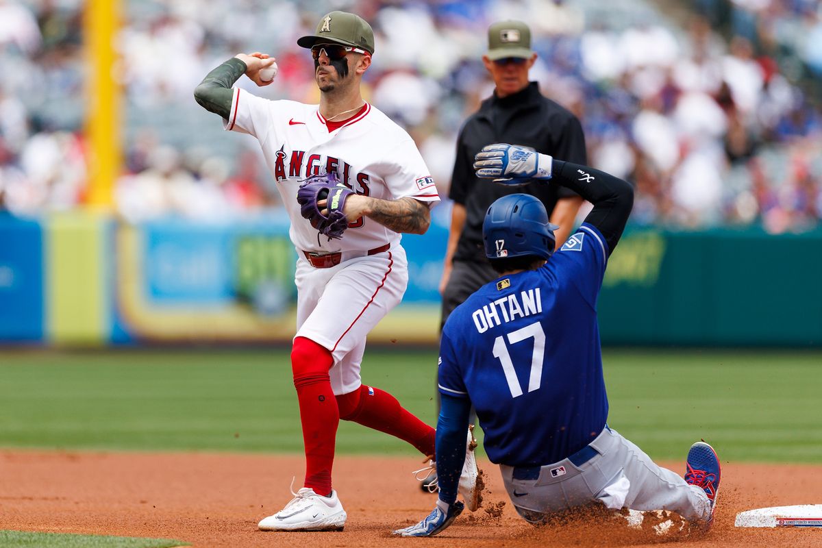 Shohei Ohtani #17 of the Los Angeles Dodgers slides into second base against Zach Neto #9 of the Los Angeles Angels during the game at Angel Stadium of Anaheim on May 17, 2026 in Anaheim, California.