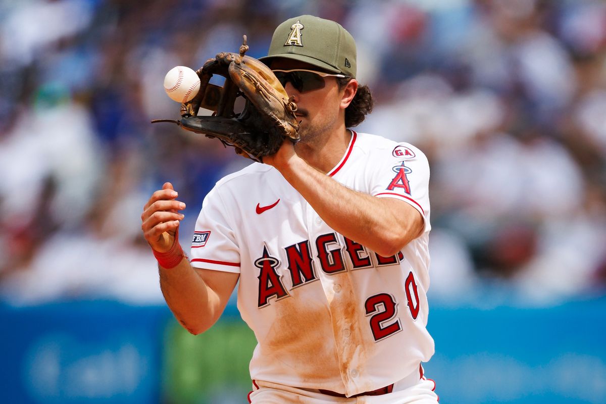 Adam Frazier #20 of the Los Angeles Angels catches a ball at second base during the game against the Los Angeles Dodgers at Angel Stadium of Anaheim on May 17, 2026 in Anaheim, California.