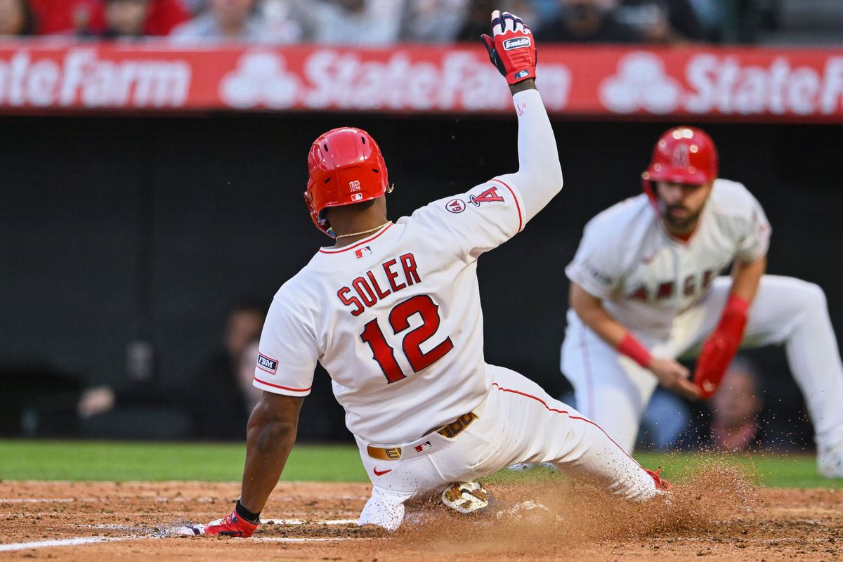 The Los Angeles Angels Jorge Soler #12 slides into home plate during an MLB game against The Texas Rangers on May 22nd, 2026 at Angels Stadium in Anaheim, California. The Los Angeles Angels Jorge Soler #12 slides into home plate during an MLB game against The Texas Rangers on May 22nd, 2026 at Angels Stadium in Anaheim, California.