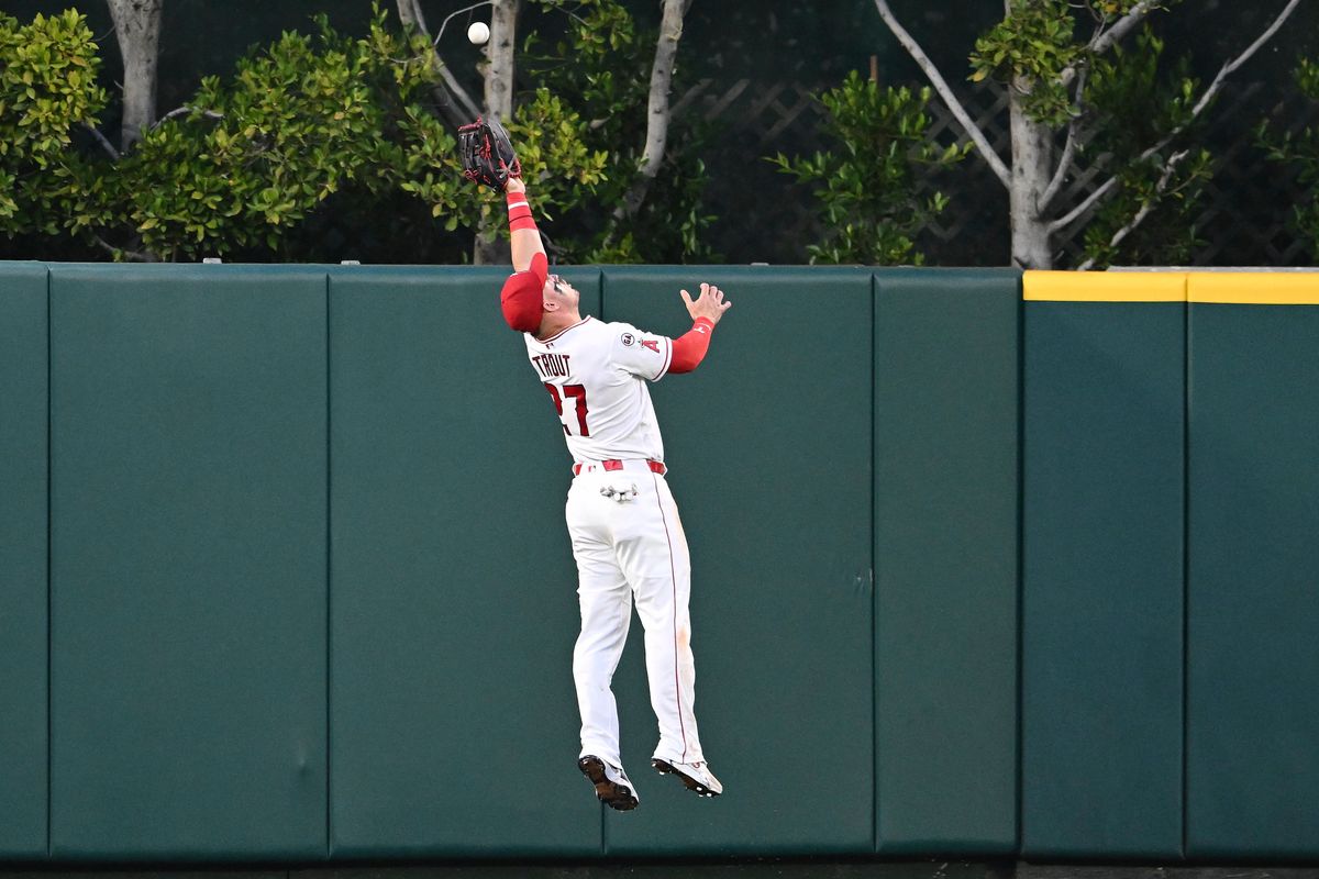 The Los Angeles Angels Mike Trout #27 jumps for a fly ball during an MLB game against The Texas Rangers on May 22nd, 2026 at Angels Stadium in Anaheim, California. The Los Angeles Angels Mike Trout #27 jumps for a fly ball during an MLB game against The Texas Rangers on May 22nd, 2026 at Angels Stadium in Anaheim, California.