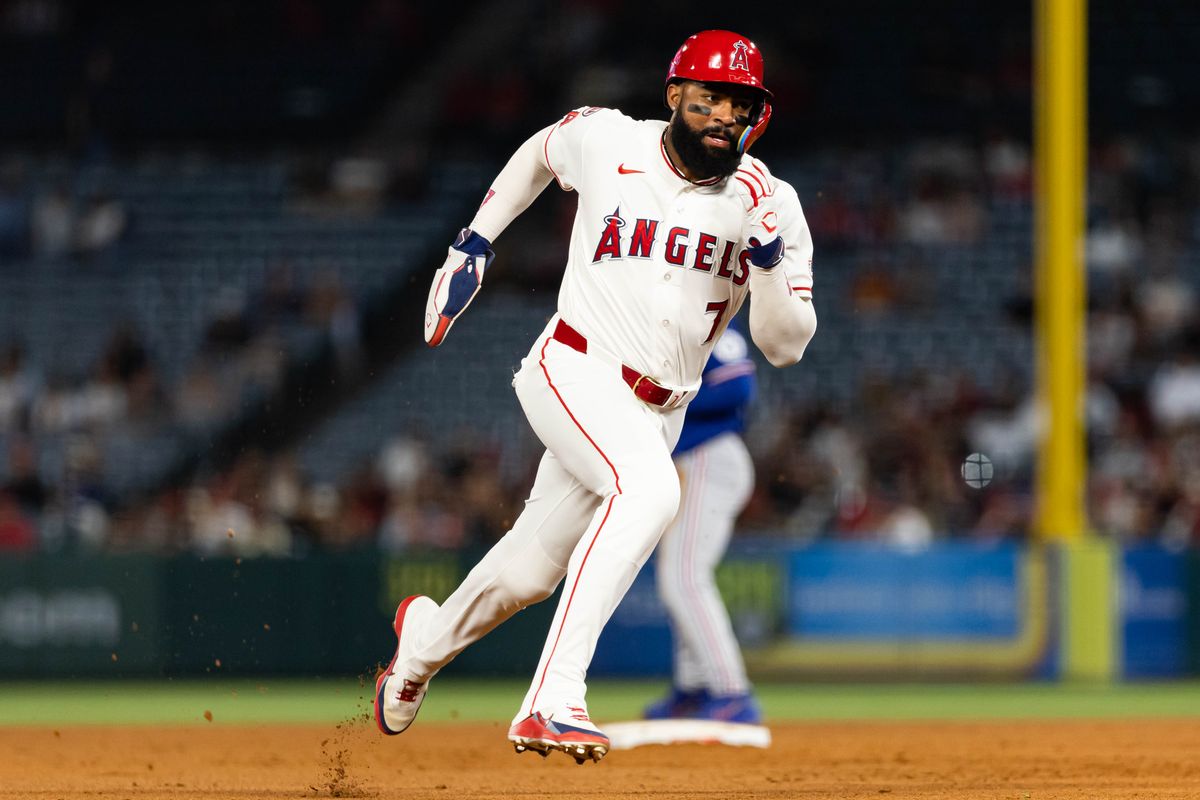 Jo Adell #7 of the Los Angeles Angels runs to third base during an MLB game against the Texas Rangers on May 23, 2026 at Angel Stadium in Anaheim, California.